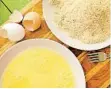  ??  ?? Prepare two bowls for dredging: one with the beaten eggs, one with the breadcrumb­s and Parmesan.