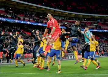  ?? AP ?? Juventus players celebrate at the end of their Champions League round of 16 second leg match against Tottenham Hotspur at Wembley in London on Wednesday. Juventus won 2- 1 to advance 4- 3 on aggregate. —