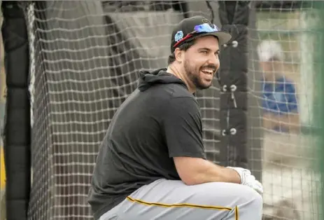  ?? For the Post-Gazette ?? Pirates catcher Austin Hedges sits between drills Sunday during spring training at Pirate City in Bradenton, Fla.
