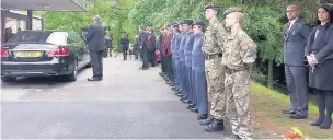  ??  ?? Cadets pay their respects at Macclesfie­ld Crematoriu­m
