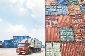  ??  ?? A truck transporti­ng a container next to stacked containers at a port in Zhangjiaga­ng in China’s eastern Jiangsu province. Washington has also lined up an additional US$200 billion in Chinese imports and US President Donald Trump said he could raise tariffs on those products to 25 per cent instead of the previously touted 10 per cent. — AFP photo