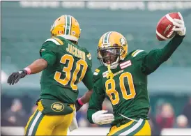  ?? Canadian Press photo ?? Edmonton Eskimos’ Bryant Mitchell (80) and Martese Jackson (30) celebrate Mitchell’s 75 yard touchdown during second half CFL action against the Ottawa Redblacks last weekend.