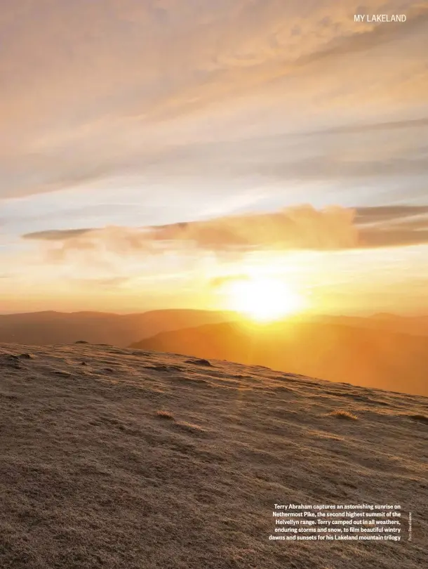  ??  ?? Terry Abraham captures an astonishin­g sunrise on Nethermost Pike, the second highest summit of the Helvellyn range. Terry camped out in all weathers, enduring storms and snow, to film beautiful wintry dawns and sunsets for his Lakeland mountain trilogy