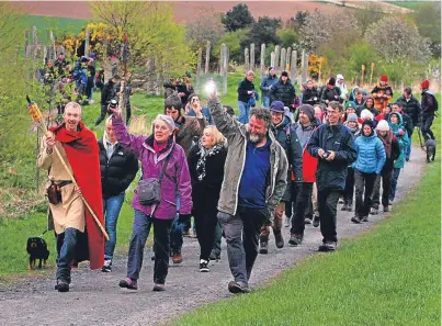  ?? Picture: Gareth Jennings. ?? The trust’s Gavin Lindsay leads walkers up the hill on Saturday.