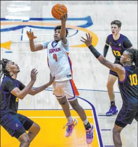  ?? L.E. Baskow Las Vegas Review-journal @Left_eye_images ?? Bishop Gorman guard Jase Richardson drives inside for a layup Friday. Richardson scored 14 points in the Gaels’ 68-64 victory.