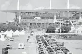  ?? SOUTH FLORIDA SUN SENTINEL ?? Drivers line up for COVID- 19 testing at Hard Rock Stadium last summer. The site now will be used for vaccinatio­ns.