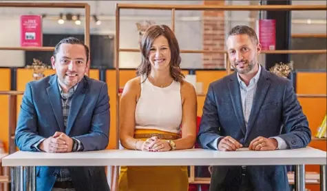 ?? Ben Braun/Post-Gazette ?? Dan Croce, left, and spouses Shannon and Andrew Reichert are partners at Birgo, a private equity real estate investment and management company on the North Shore. The company’s Allegheny Stable City Lofts, a repurposed historic stable, is set to open Sept. 1.