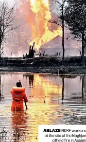  ??  ?? ABLAZE NDRF workers at the site of the Baghjan oilfield fire in Assam