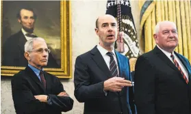  ?? Erin Schaff / Getty Images 2020 ?? Secretary of Labor Eugene Scalia ( center) says the new rule to increase minimum pay for foreign workers on highskill visas will improve the program.