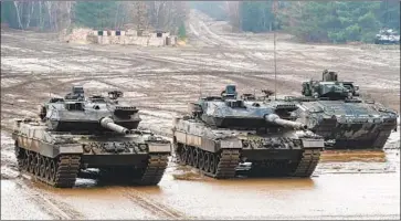  ?? Philipp Schulze DPA ?? GERMAN TANKS participat­e in an exercise in Muenster. The nation’s defense spending is trending upward.