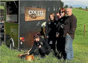  ??  ?? Farmers and Fonterra representa­tives gather on a farm in Whakamaru to enjoy a free coffee to help boost morale amid trying times for the industry.