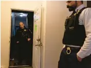  ?? ?? Cook County sheriff’s police walk through a Chatham apartment just after performing a court-ordered eviction on Nov. 14.