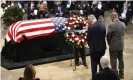  ?? Photograph: Getty Images ?? The Senate minority leader, Chuck Schumer, and the South Carolina senator Tim Scott place a wreath at the casket of the late congressma­n John Lewis.