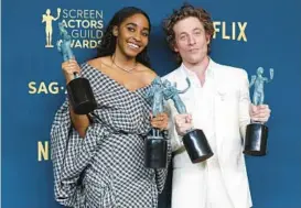  ?? FRAZER HARRISON/GETTY ?? Ayo Edebiri and Jeremy Allen White, who star together in “The Bear,” hold their trophies Feb. 24 during the Screen Actors Guild Awards in Los Angeles.