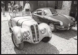  ??  ?? Betty Haig at the wheel of her BMW 328, in which she regularly gave passenger rides at her home, Shellingfo­rd House, where she also hosted early Porsche Club GB events