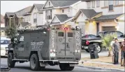  ?? RODOLFO GONZALEZ / AMERICAN-STATESMAN ?? A Hays County SWAT vehicle departs after a man was suspected of shooting his wife July 20 in Buda. Austin suburbs’ violent crime rate in 2015 was below that of other nonmajor cities in Texas.