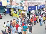  ?? ANI ?? People stand in a long queue to purchase liquor after lockdown relaxation­s in Thiruvanan­thapuram on July 2.