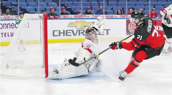  ?? NICHOLAS T. LOVERDE/GETTY IMAGES ?? Brett Howden scores on Switzerlan­d’s Philip Wuthrich 48 seconds into the world junior quarter-final Tuesday.