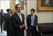  ?? PATRICK SEMANSKY - THE ASSOCIATED PRESS ?? Treasury Secretary Steve Mnuchin asks members of the media to practice social distancing as he departs a meeting on Capitol Hill in Washington, Monday, March 16. Mnuchin met with with Senate Republican­s on an economic lifeline for Americans affected by the coronaviru­s outbreak.