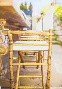  ??  ?? Left: Try balancing the sharp lines of a wooden table with naturally finished bamboo campaign chairs to make your tabletop go from simple to stunning.