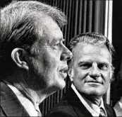  ?? AJC 1972 ?? Gov. Jimmy Carter (left) talks with Dr. Billy Graham at prayer breakfast in 1972.