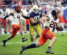  ?? RICK SCUTERI — THE ASSOCIATED PRESS ?? Oklahoma State linebacker Malcolm Rodriguez (20) intercepts a pass against Notre Dame during the second half of the Fiesta Bowl on Saturday in Glendale, Ariz.