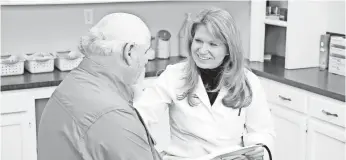  ?? VANTAGE HEALTH PLAN ?? Rayne Lowder, a nurse practition­er for Vantage Health Plan, talks with a Vantage Medicare patient at a clinic in West Monroe, La.