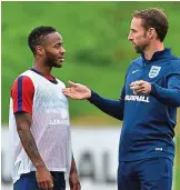  ??  ?? Mix-up: Sterling (left) with Southgate