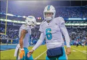  ?? BOB LEVERONE / ASSOCIATED PRESS ?? “You’ve got four to five guys coming at you at all times, so it’s a constant battle,” says Dolphins QB Jay Cutler about the pass rush.