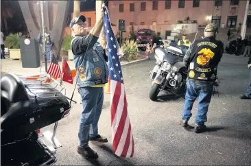  ?? PHOTOS BY DAVID CRANE — STAFF PHOTOGRAPH­ER ?? Members of the Patriot Guard Riders prepare to honor the Fire Hogs, a group of mostly retired LAFD Harley Davidson riders, as they depart from Los Angeles on a nearly 3,000-mile journey to New York to honor victims of 9/11on Monday.