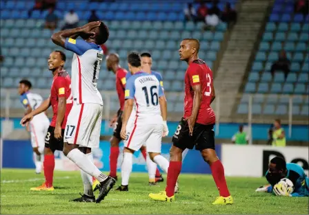  ?? ASSOCIATED PRESS ?? UNITED STATES’ JOZY ALTIDORE (LEFT) REACTS Couva, Trinidad, Tuesday. after missing a chance to score during a 2018 World Cup qualifying soccer match against Trinidad and Tobago in