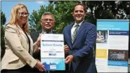  ?? MID-HUDSON NEWS NETWORK PHOTO ?? Kelly Turturro, regional director of the state Department of Environmen­tal Conservati­on, presented a “climate smart” plaque to Sullivan County Legislatur­e Chairman Luis Alvarez, center, and Sullivan County Manager Joshua Potosek, right.