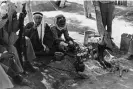  ?? ?? Men of the Arab Legion in Transjorda­n smoke cigarettes outside near a row of urns in 1941. Photograph: Hulton Deutsch/Corbis/ Getty Images