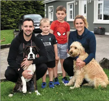  ?? Photo by Michelle Cooper Galvin ?? Jonthon and Shauna O’Connor with their sons (centre) Joshua and Callum and their two dogs, Rubble and Coca, at home in Rockfield, Killarney, on Tuesday.