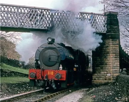  ??  ?? Where the seed was sown: ex-Longmoor ‘Austerity’ No. 118 engulfs the footbridge at Haworth (KWVR) in the mid-1970s.