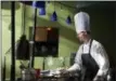  ?? CHRISTOPHE­R MASSA PHOTO ?? Skidmore College chef Joe Greco stirs a pan during the eighth annual American Culinary Federation Competitio­n. Skidmore won a gold medal and scored the highest points at the event.