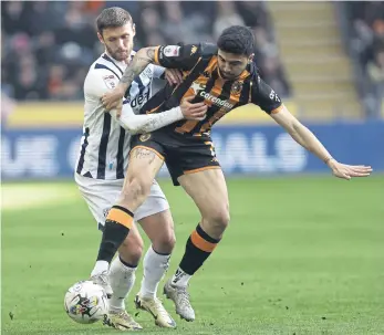  ?? ?? STALEMATE: West Bromwich Albion’s John Swift, left, and Hull City’s Ozan Tufan battle for the ball during the Sky Bet Championsh­ip match at the MKM Stadium.