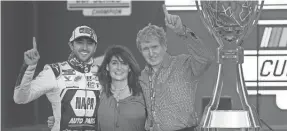  ?? CHRIS GRAYTHEN/GETTY IMAGES ?? Chase Elliott celebrates with his mother
Cindy Elliott and father, NASCAR Hall of Famer
Bill Elliott, in victory lane on Sunday after winning the NASCAR Cup Series championsh­ip at Phoenix Raceway.