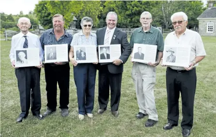  ?? JESSICA NYZNIK/EXAMINER ?? Kevin Leahy (inductee), left, Wayne Telford (inductee’s family member), Barbara Nichols (inductee’s family member), J. Francis Crowley (inductee), Hudson Milburn (inductee’s family member), and Gary Stewart (inductee’s family member), hold citations of...
