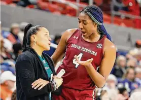  ?? Butch Dill/Associated Press ?? South Carolina head coach Dawn Staley talks with forward Aliyah Boston during the second half against Auburn on Thursday.