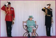  ??  ?? The Queen watches yesterday’s ceremony which took place in honour of her birthday