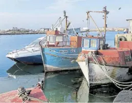  ?? DPA-BILD: Falk Zielke ?? Dass viele in Lamberts Bay auch heute noch vom Fischfang leben, ist im Hafen unschwer zu erkennen.