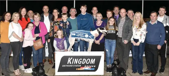  ?? Photo by www.deniswalsh­photograph­y.com ?? Twins Cal and Saorla Cronin accepting the winner’s trophy on behalf of the winning syndicate presented by Club Chairman Mike O’Brien after Monevassia won the Fr Caseys Ladies GAA Stakes Buster Final at the Kingdom Stadium on Saturday. Included are syndicate members, Johnny Kelliher, Johnny O’Keeffe, Darragh Sheehan and Paddy O’Callaghan with members of the GAA organising committee and connection­s.