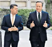  ?? ?? David Cameron, the Foreign Secretary, meets with Fabian Picardo, Gibraltar’s Chief Minister