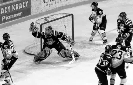  ?? CAPE BRETON POST • FILE ?? Chicoutimi Saguenéens goaltender Jeff Deslaurier­s, middle, makes a glove save during Game 5 of the 2004 playoff series against the Cape Breton Screaming Eagles at Centre 200 in Sydney on April 9, 2004.