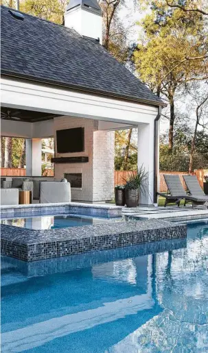  ?? AVEA Pools / Frankel Building Group ?? This pool by AVEA Pools has a hot tub, steps and swimming area with a simple design.