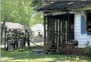  ??  ?? Diane Wagner / RN-T
Rome-Floyd County firefighte­rs discuss their next steps to secure the structure Monday after dousing the flames that gutted a home at 214 E. 20th St. just before 2 p.m.