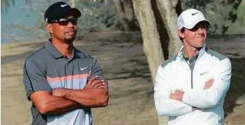  ?? Rex Features ?? According to Clarke, Rory McIlroy (right) can claim his first Masters crown on April 6, while it would be foolish to write off Tiger Woods, who still has it in him to win a Major.