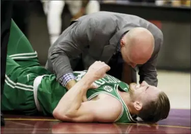  ?? TONY DEJAK — THE ASSOCIATED PRESS ?? Boston Celtics’ Gordon Hayward grimaces in pain in the first half of an NBA basketball game against the Cleveland Cavaliers, Tuesday in Cleveland. Just five minutes into his Boston career, new Celtics star forward Gordon Hayward gruesomely broke his...