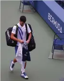  ?? Photograph: Al Bello/Getty Images ?? Djokovic walks off after being defaulted for inadverten­tly striking a lineswoman with a ball at the 2020 US Open in September.